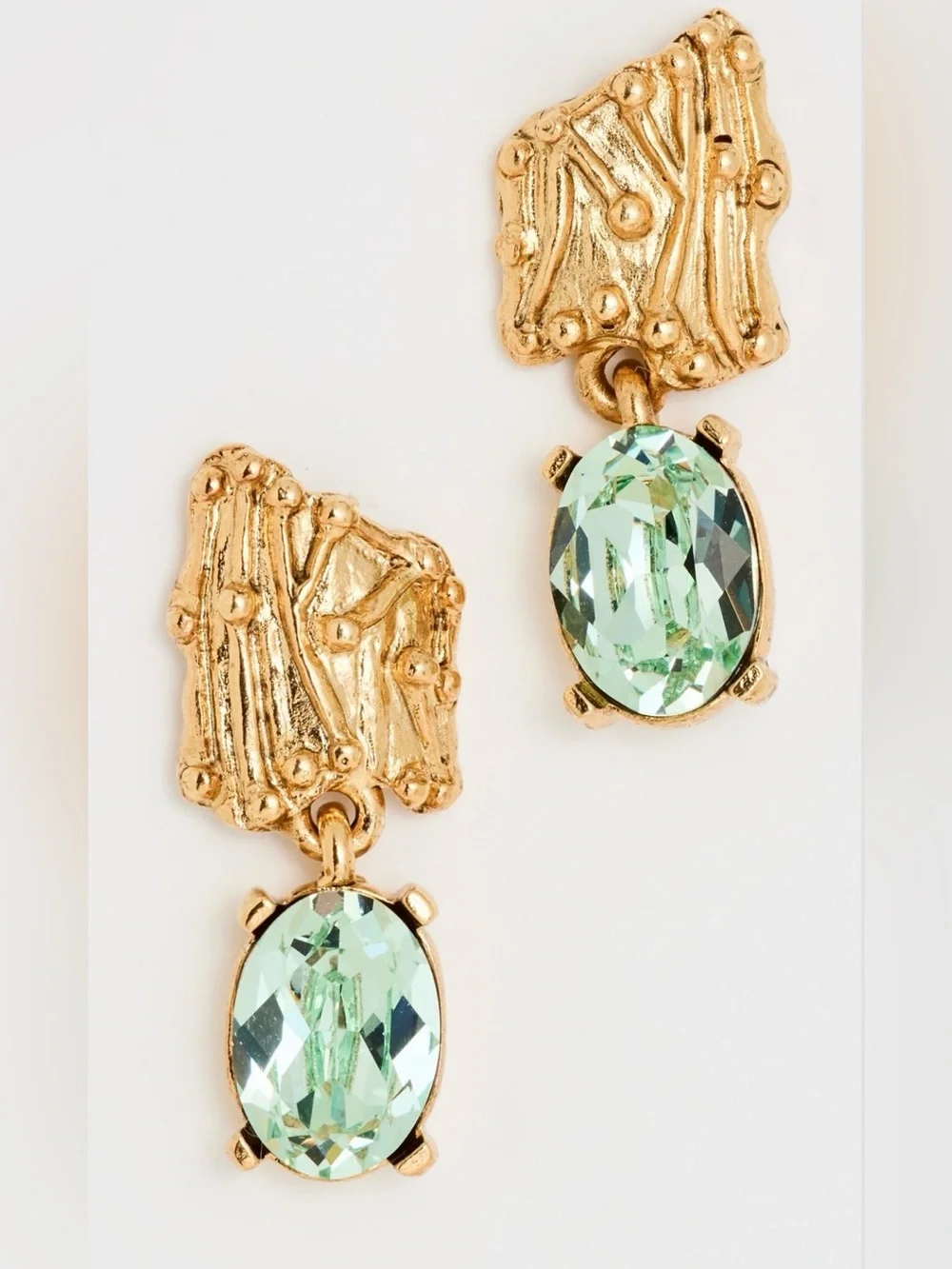 OSCAR DE LA RENTA • Enoki Shield Crystal Drop Earrings in Peridot Green.